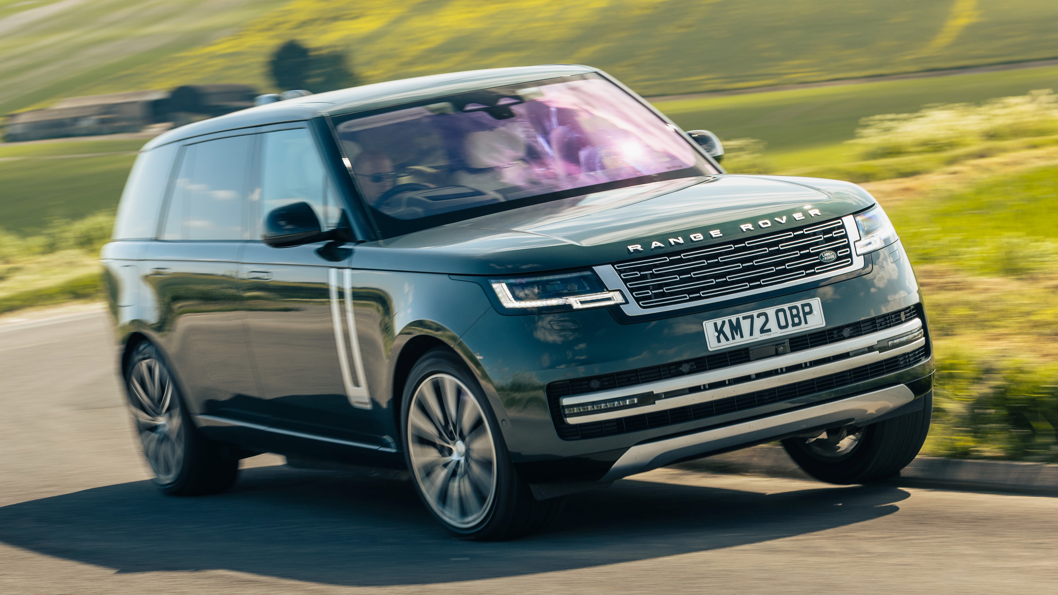 Range Rover driving on a country road